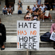 The protester holds a banner reading “Hate Has No Home Here” during a rally against U.S. President Donald J. Trump for threatening North Korea and Venezuela with attacking next to the Trump Tower in the Manhattan borough of New York, the United States, on August 14, 2017.
